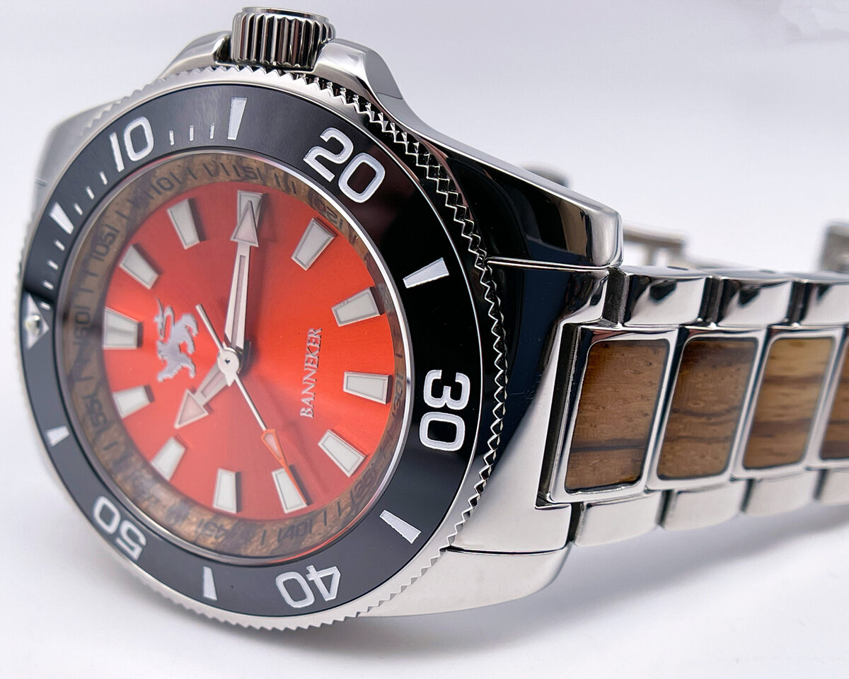 A Banneker Nice Collection diver with a red dial and wood-link band