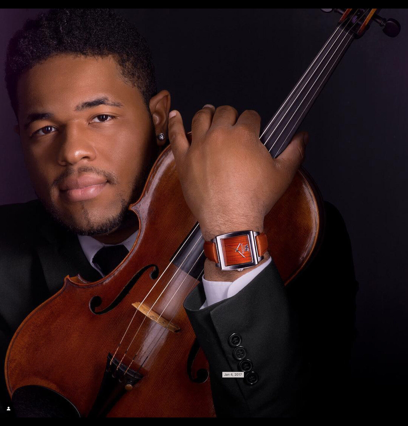 A violinist wearing a Banneker watch